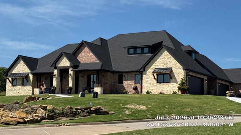 Finished concrete tile roof on a Mediterranean-style home in Ardmore, Oklahoma