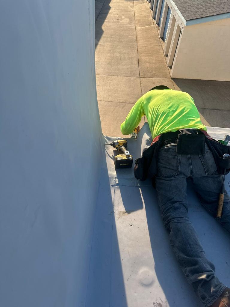 Flat commercial membrane roof with crew working, Midwest City, Oklahoma